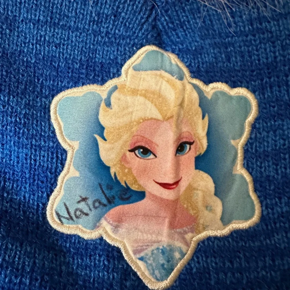 Disney Frozen Blue Beanie with White Pom Pom - Natalie written on it